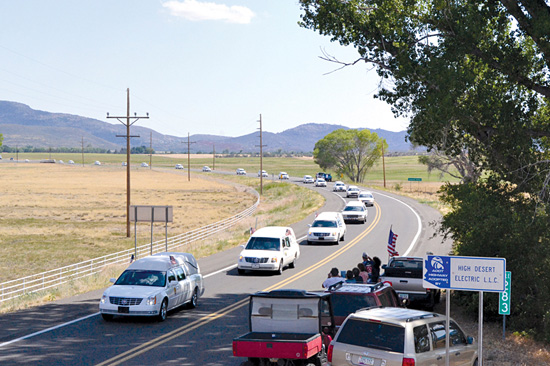 The Granite Mountain Hotshots honor guard motorcade rolls through Peeples Valley. Photo: John Dougherty 