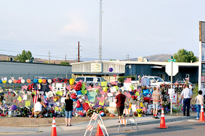 A makeshift memorial wraps around the Granite Mountain Hotshot station in downtown Prescott. Photo: John Dougherty