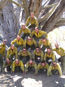 Granite Mountain Hotshots in front of an ancient tree on Granite Mountain after saving the tree during the June 2013 Doce Fire. Photo by Christopher MacKenzie